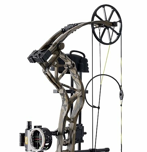 Close-up of a compound bow with camouflage design and pulley system.